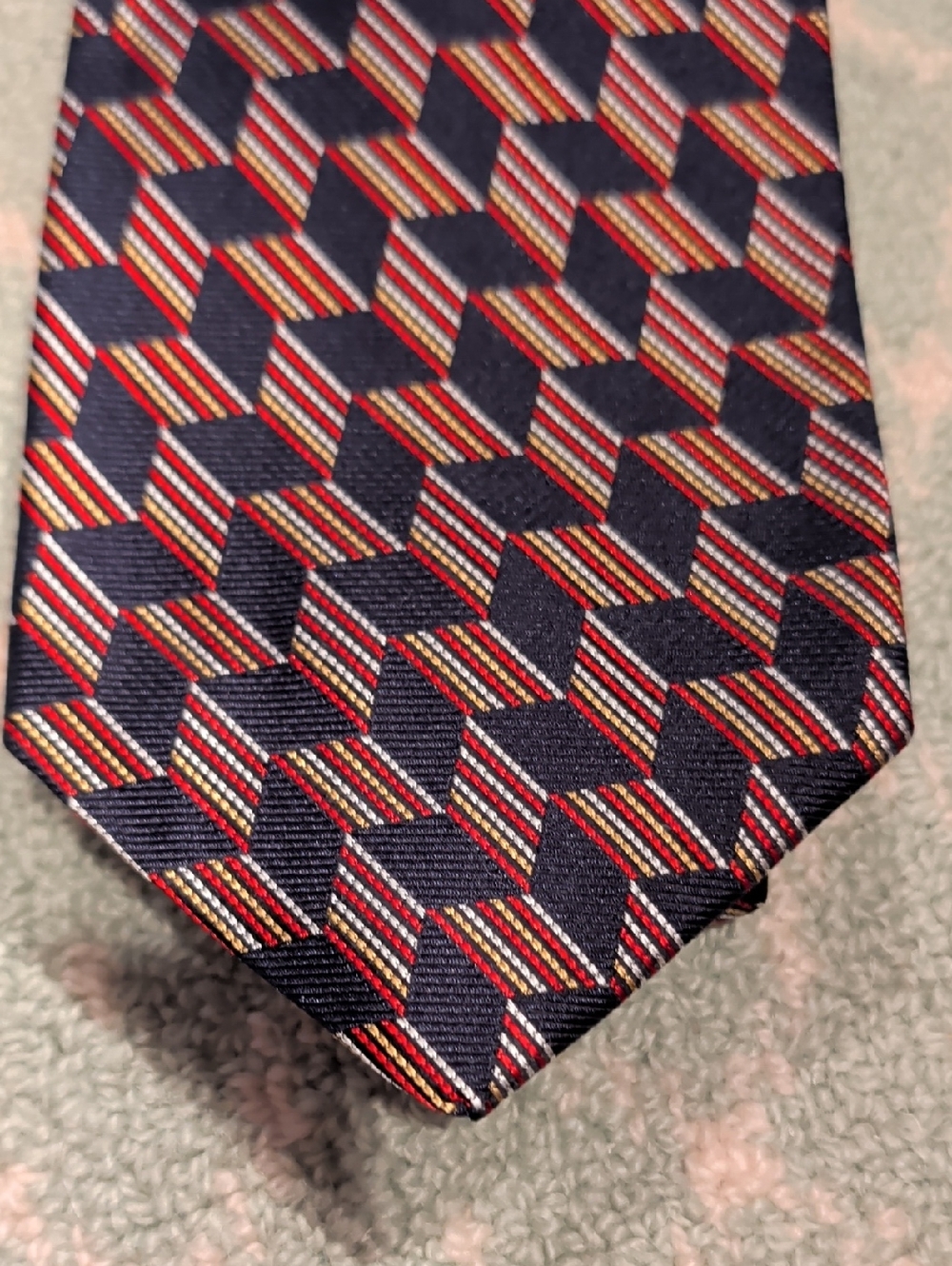 Paul Frederick Navy Geometric Optical Illusion Men's Tie with Red Accents.